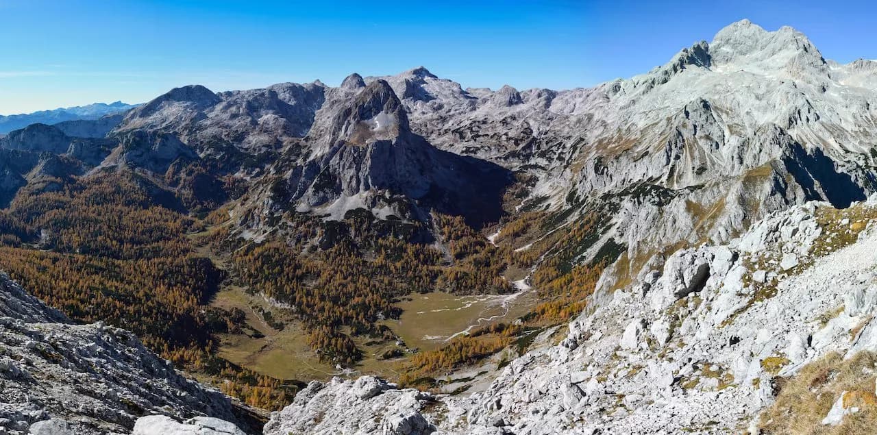 View of Velo Polje valley with autumn larch trees from Vodnik Hut, Julian Alps.