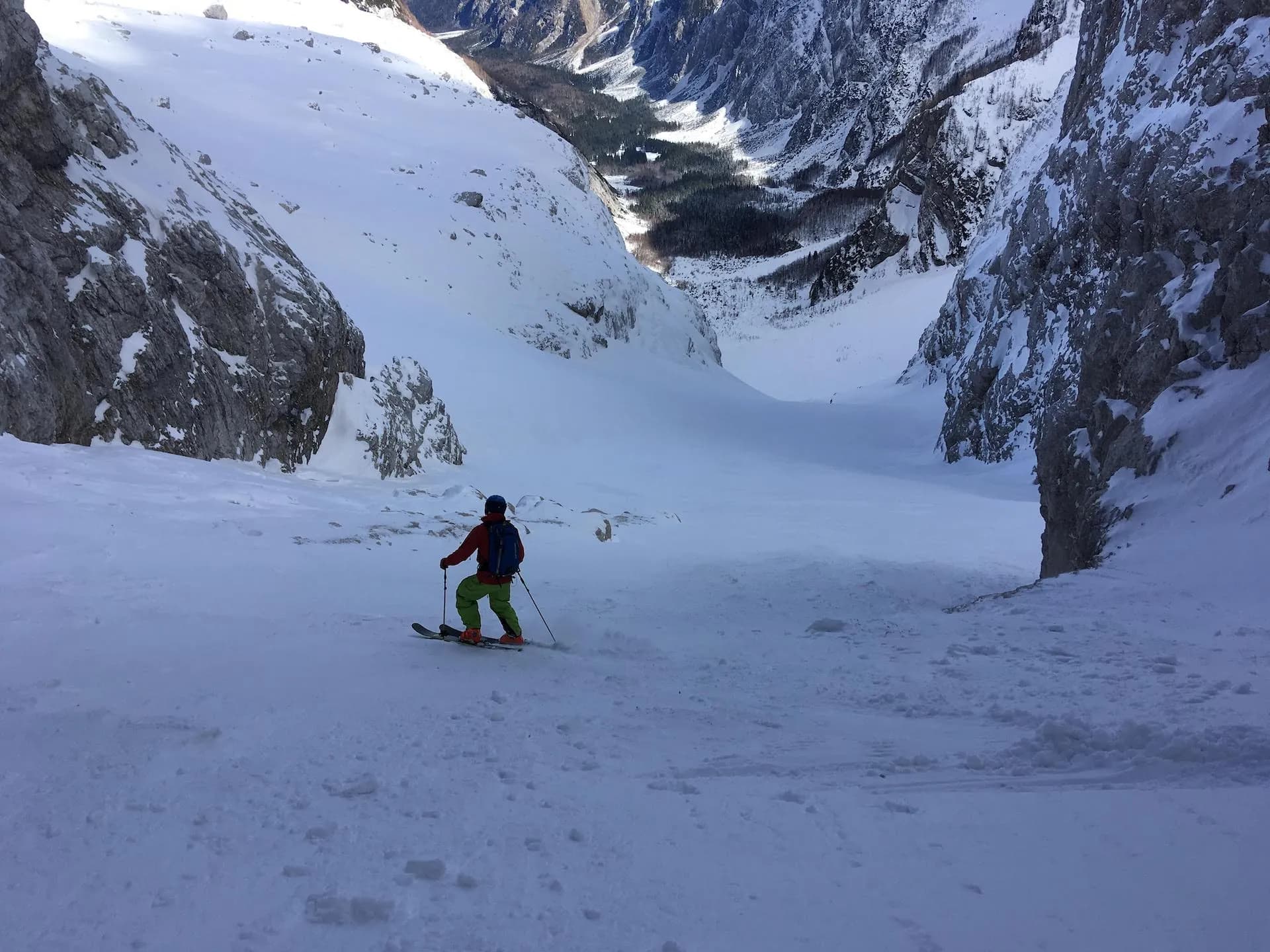 Skiing down a steep, snow-covered mountain valley above Tamar Valley.