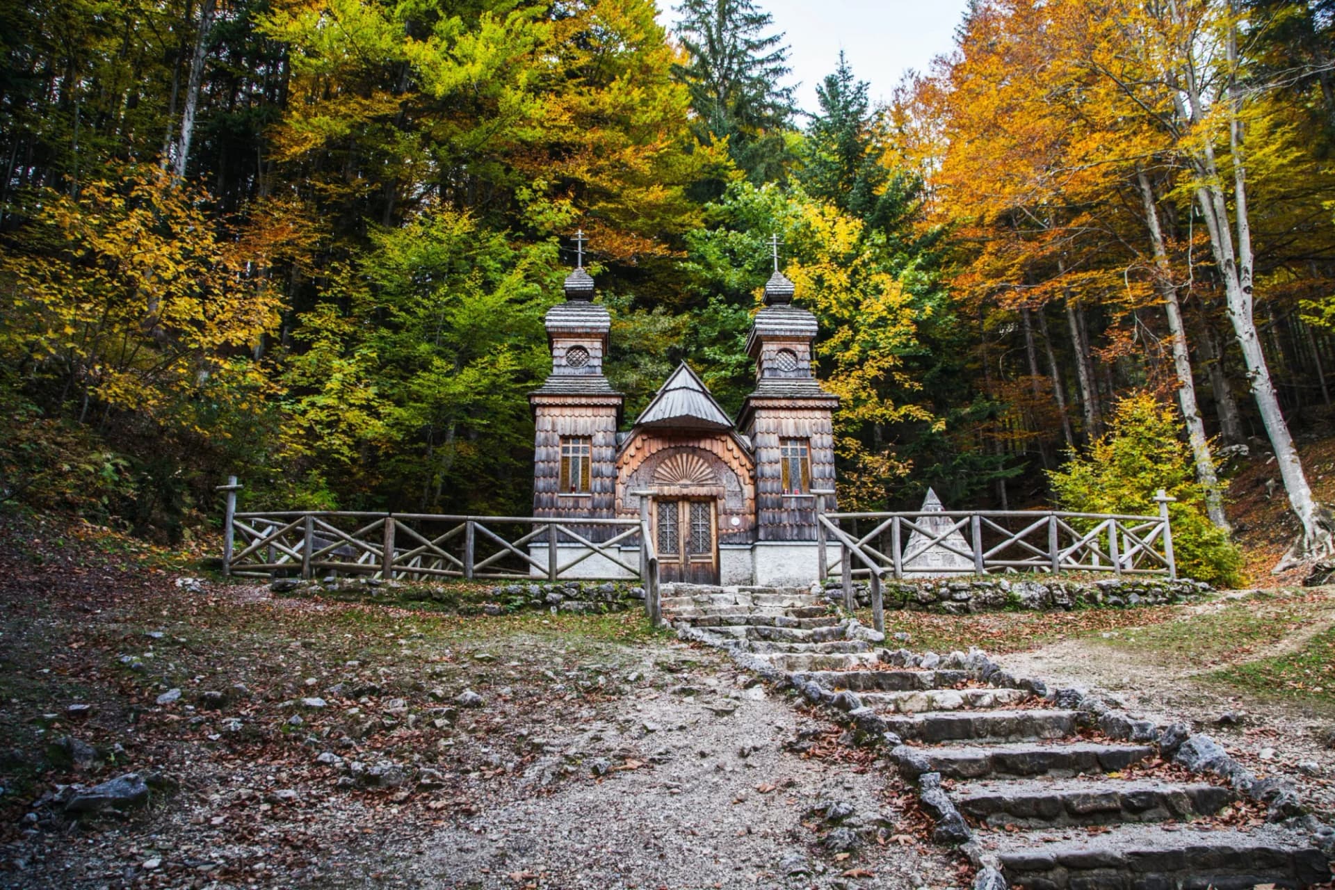 Russian Chapel in Triglav National Park with autumn forest and stone steps