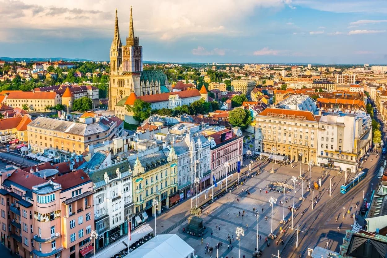Zagreb panorama showing the Cathedral and Ban Jelačić Square with a tram.