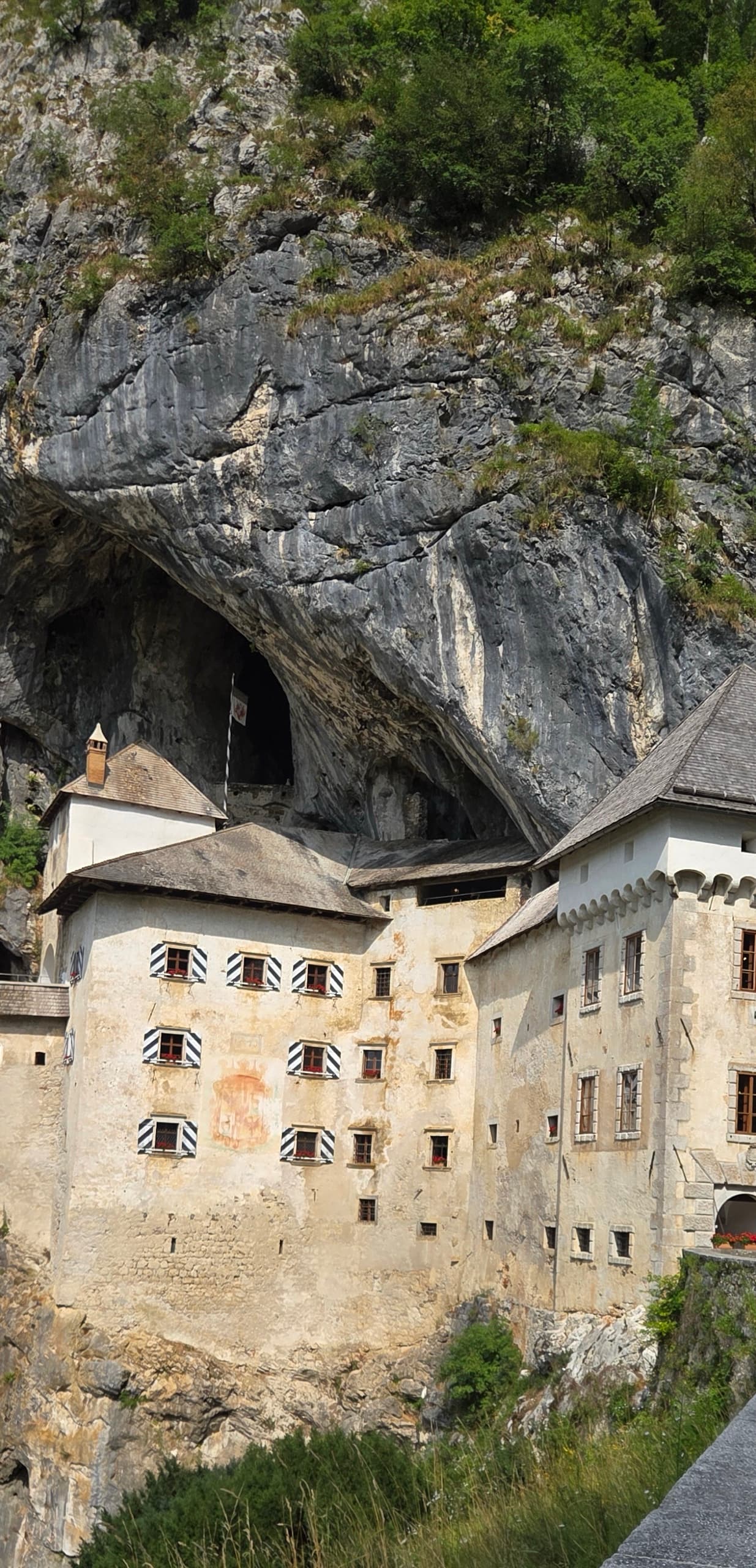 Predjama Castle built into a massive cliff cave opening